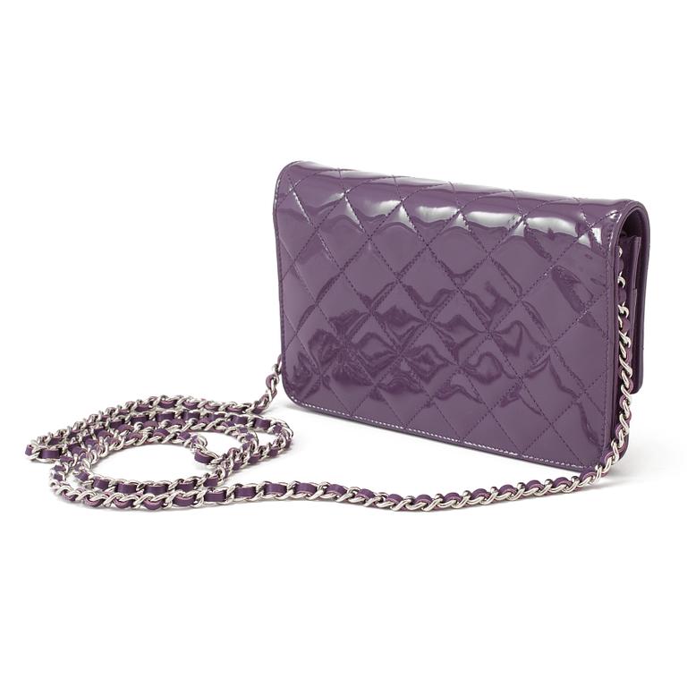 A purple lacquer handbag by Chanel  2011.