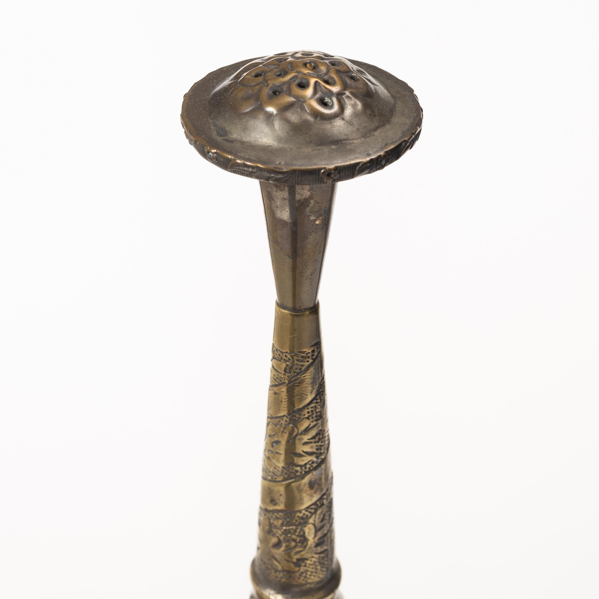 An 20th century british Raj repoussé metal rosewater sprinkler.