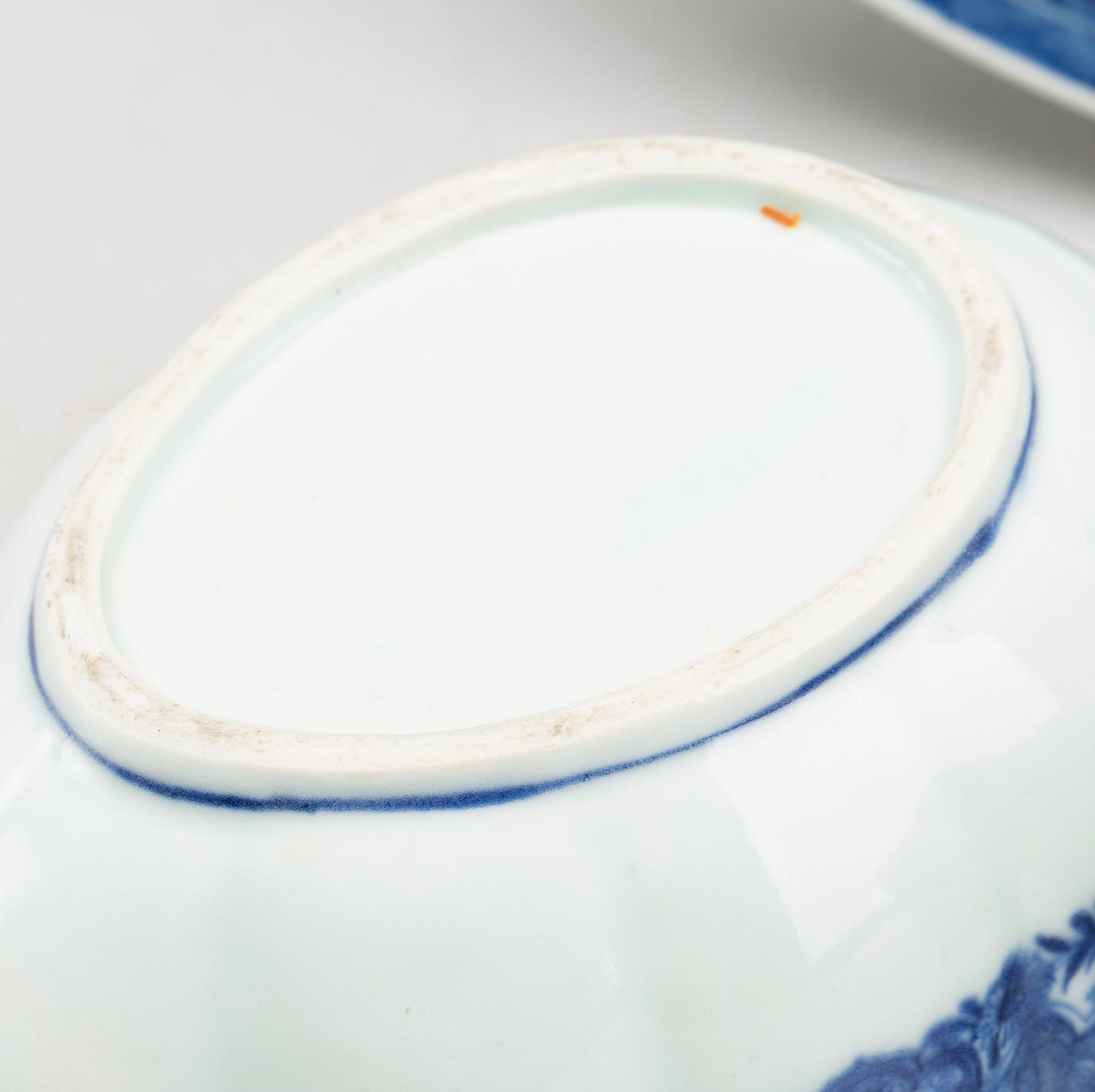 A blue and white Chinese Qianlong porcealin pair of sauce boats and a serving dish.