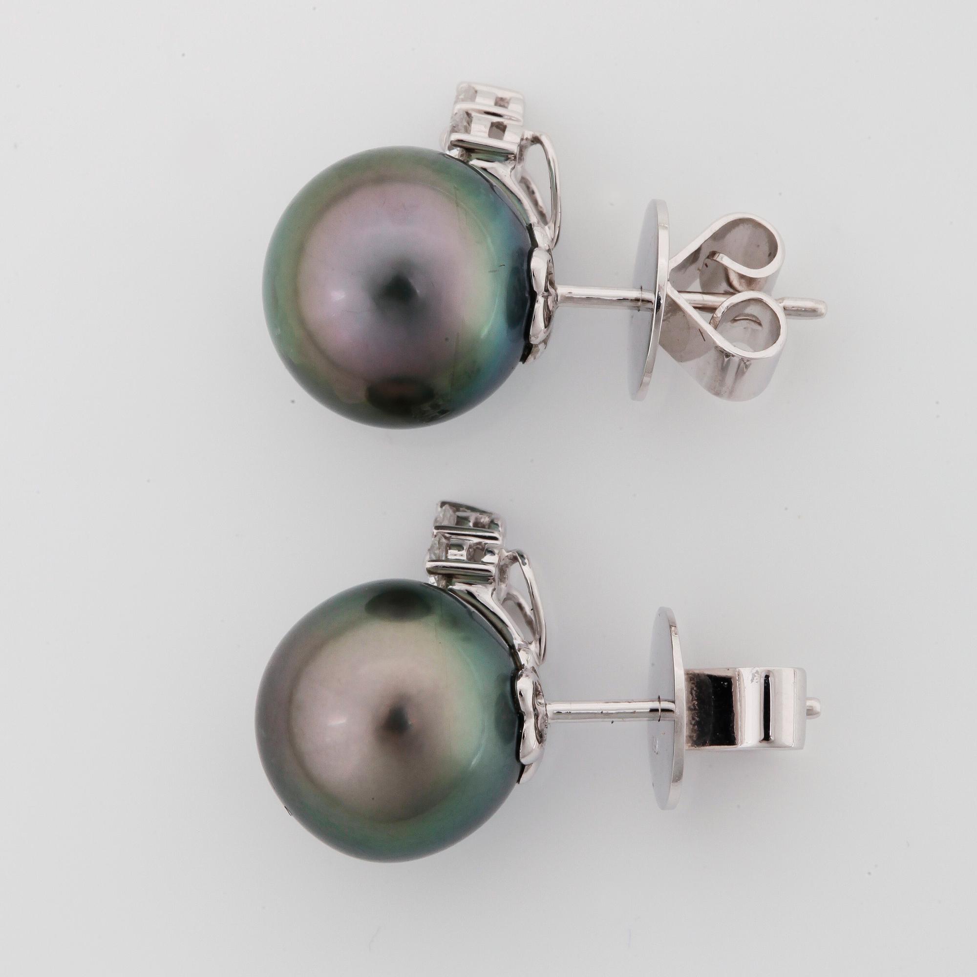 EARRINGS, studs with black cultivated pearls circa 11mm and diamonds circa 0.30cts.