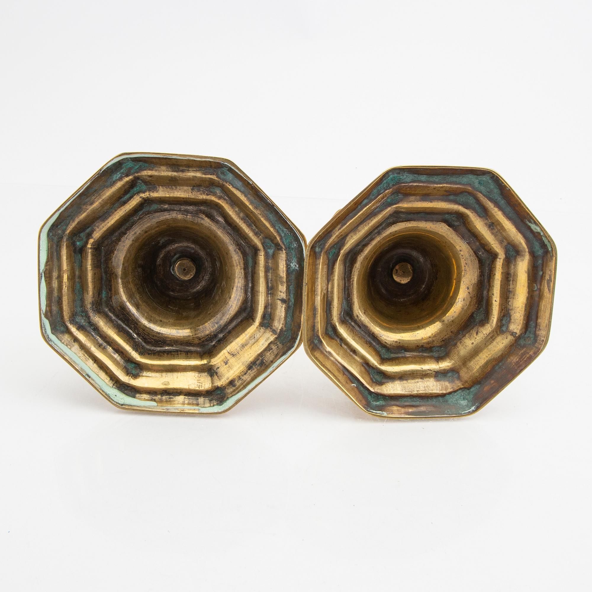 A pair of 18th century brass candle sticks.