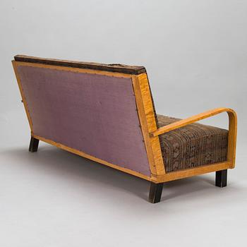 A  1920s Carelian birch veneered sofa.