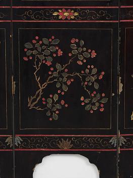 A Chinese four panel lacquer folding screen, first part of the 20th century.
