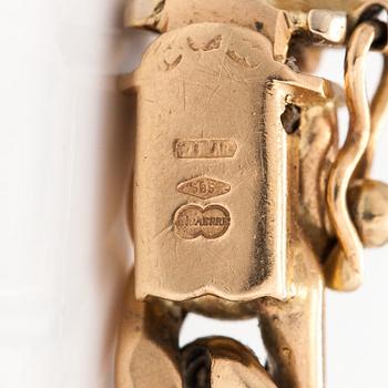 A 14K gold bracelet.