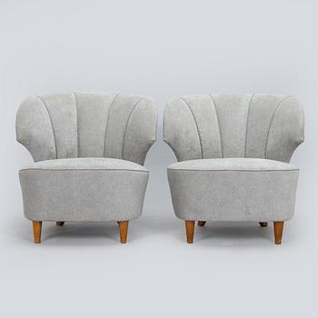 A pair of mid 20th century armchairs.