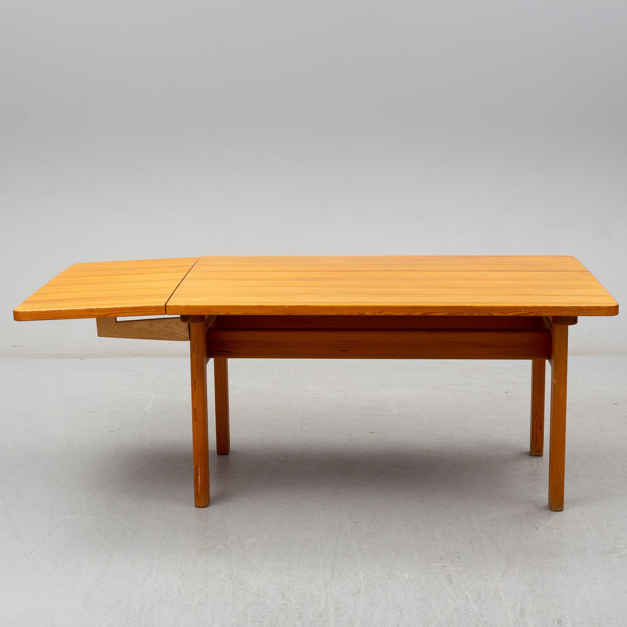 BØRGE MOGENSEN, a pine 'Asserbo' table and eight chairs from Karl Andersson & Söner.