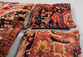 Six pillows made from rugs.