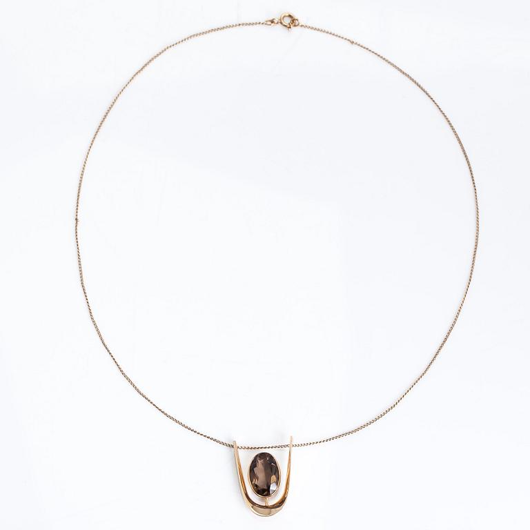 Eero Rislakki, A 14K gold and smokey quartz necklace. Westerback, Helsinki 1961.