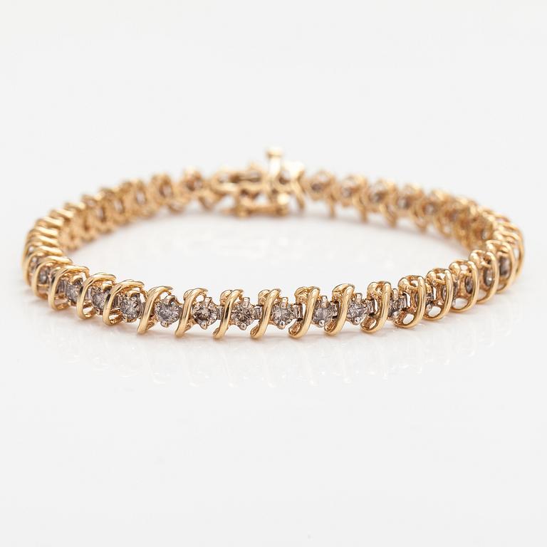 A 14K gold bracelet with light brown diamonds ca. 2.38 ct in total.