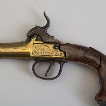 A secon half of the 19th century pair of Queen Anne brass percussion pistols converted from flintlock by Brueton, London.