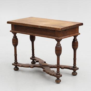 A table, late 19th century. Baroque style.