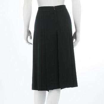 CÉLINE, a green wool skirt, size 48.