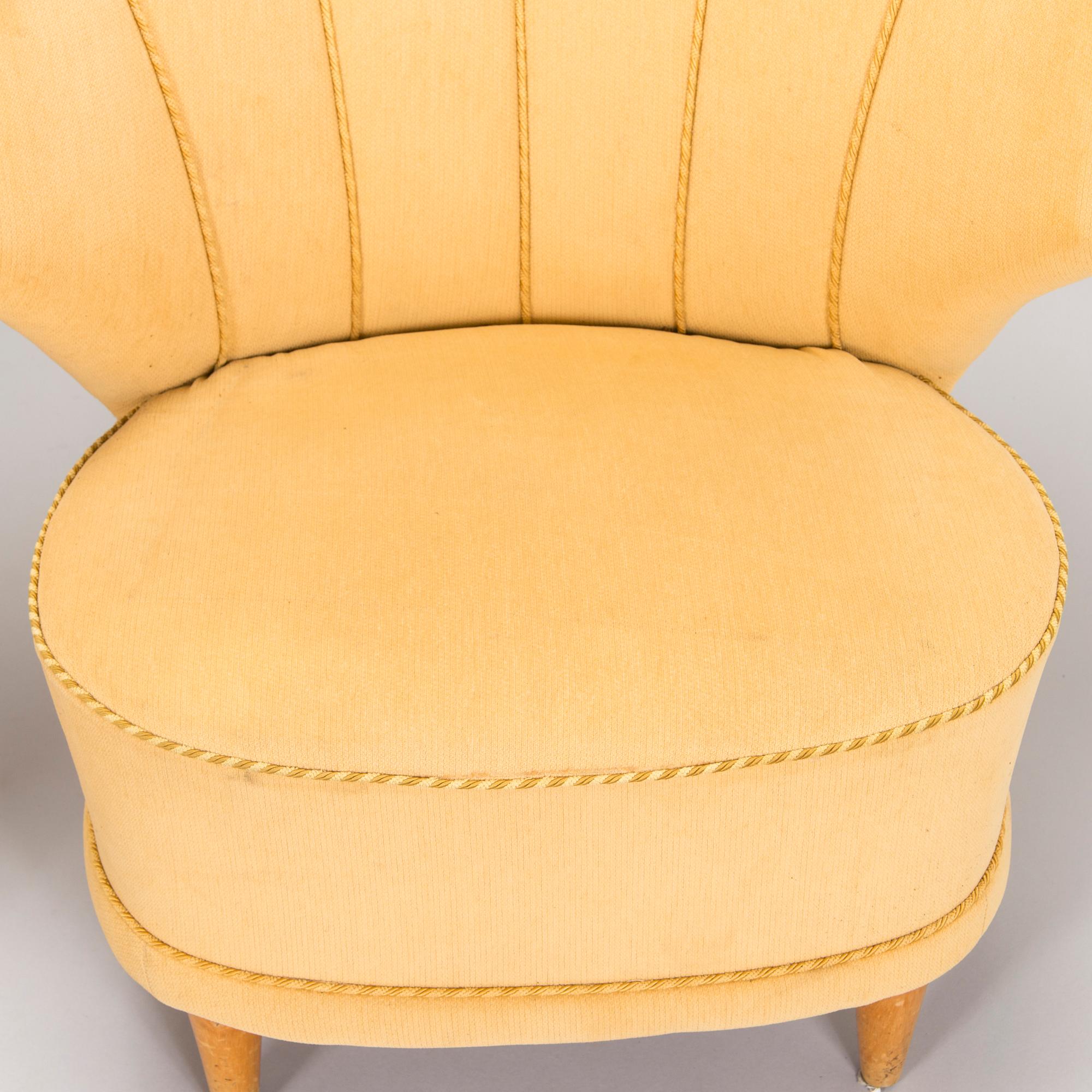 A pair of mid-20th century armchairs.