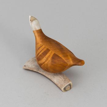 LARS LEVI SUNNA, a birch figurine of a grouse, signed LLSunna.