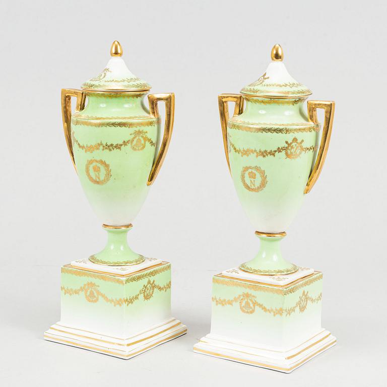 A pair of porcelain urns, possibly naples, first half of the 20th century.
