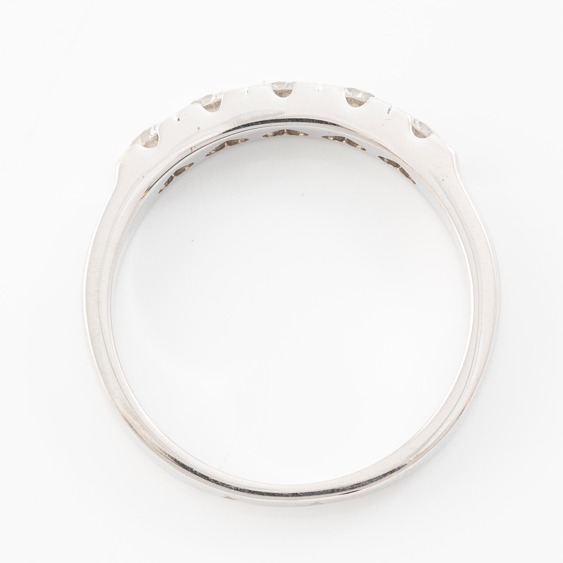 Ring 18K white gold half eternity band set with brilliant-cut diamonds.