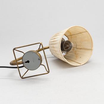 A mid-20th-century table lamp
/wall light for Idman.