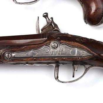 A pair of Swedish flintlock pistols by Petter Rundberg (1718-80), master in 1752.