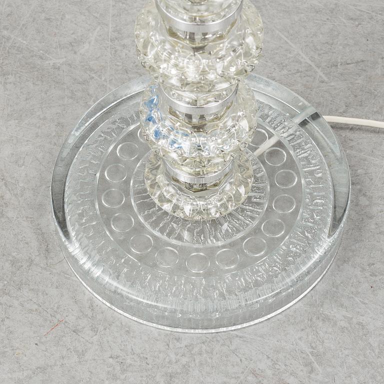 A glass floor lamp.