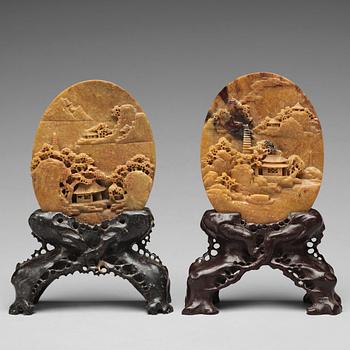 700. Two Chinese soapstone placques and stands, early 20th Century.