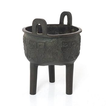 A Chinese tripod bronze censer, Ming style, Qing dynasty (1644-1912).