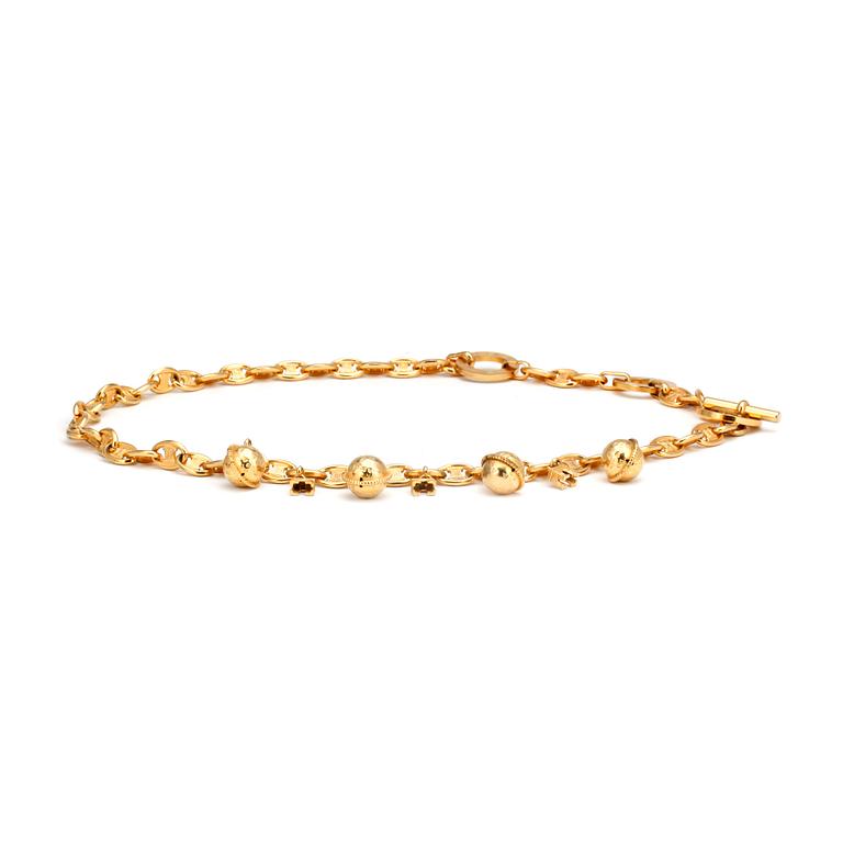 CÉLINE, a gold colored chain / necklace.