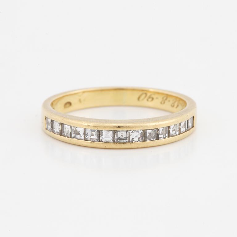Step-cut diamond ring.