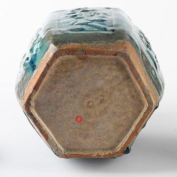 A green glazed jar and an olive glazed pot with handles, Qing dynasty, 19th Century.