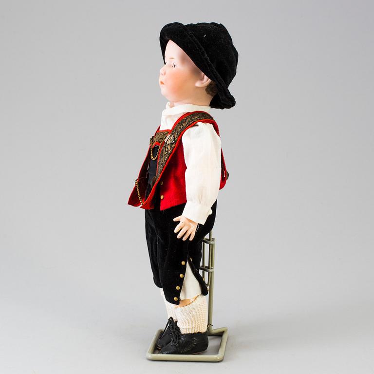 A bisque headed boy doll by Heubach, Germany, 1910s.