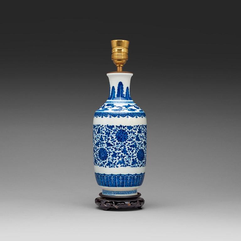 A blue and white vase decorated with lotus-scrolls and bats among clouds, Qing Dynasty, 19th Century.