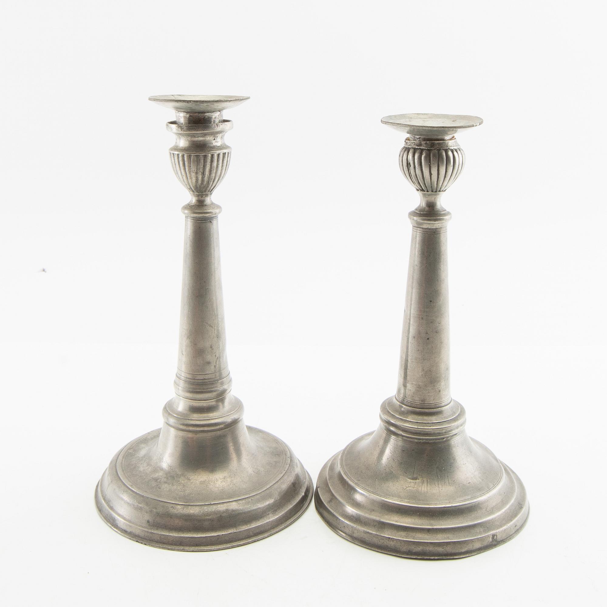 Candle holders, two pieces of pewter, 1850s.