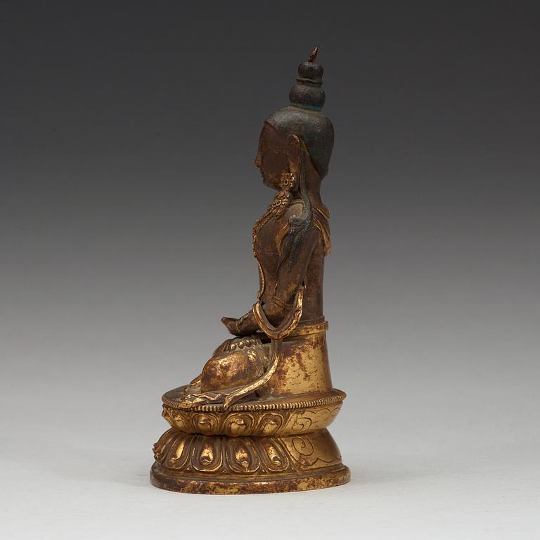 A gilt copper figure of Amitayus, Tibeto-Chinese, 18th Century.