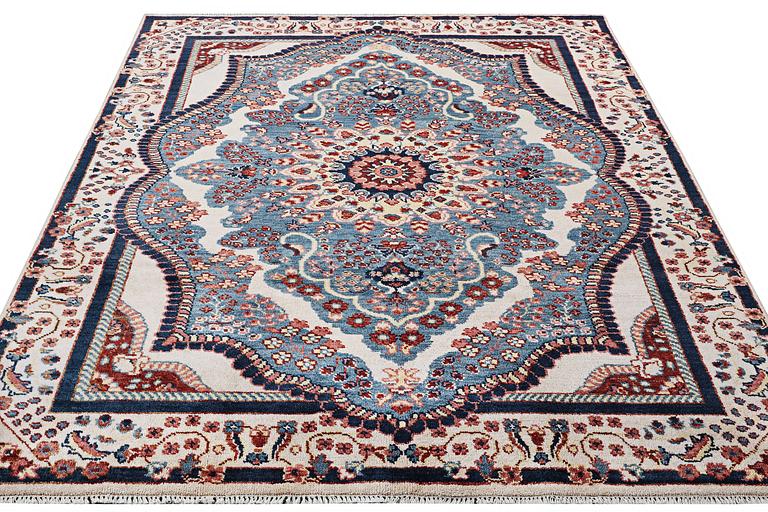 An oriental carpet with Mamluk design, c. 300 x 242 cm.