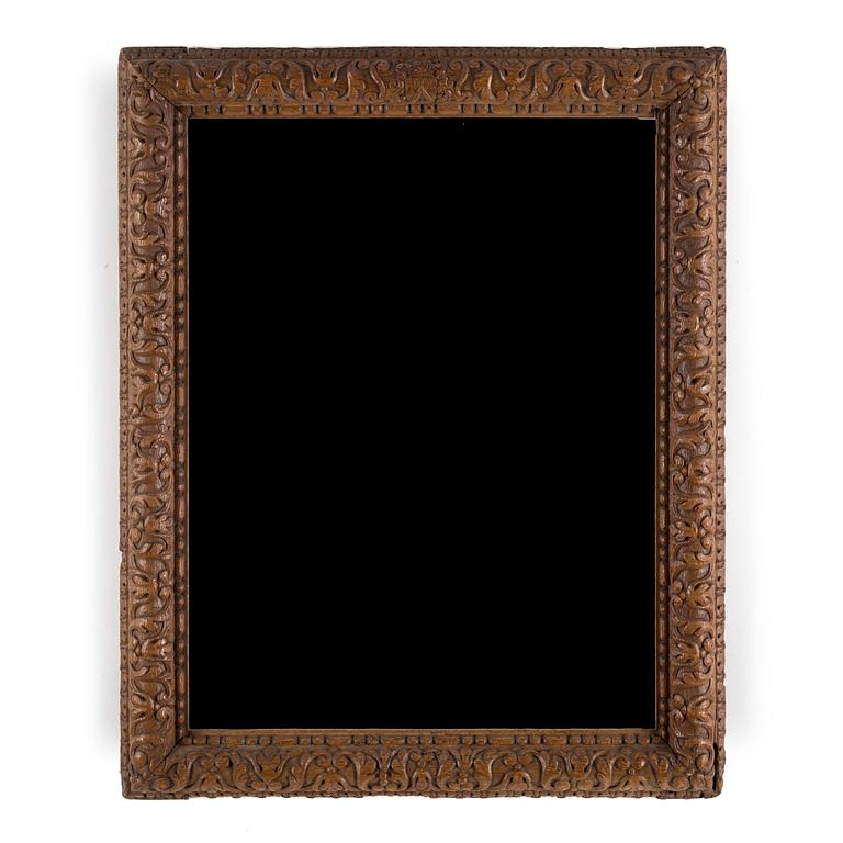 AN 18TH CENTURY OAK PICTURE FRAME.