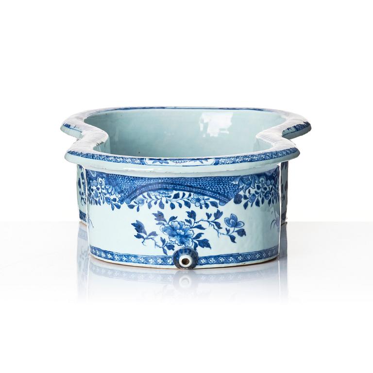 A blue and white bidet with a wooden stand, Qing dynasty, Qianlong (1736-95).