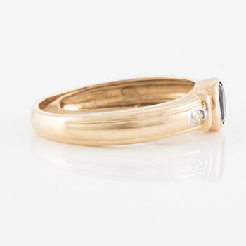 Ring, 14K gold with an oval-cut sapphire and brilliant-cut diamonds.