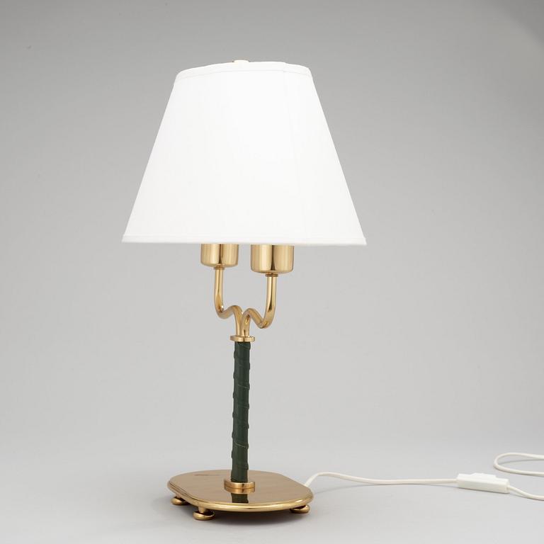 A Josef Frank brass and green leather table lamp, Svenskt Tenn, model 2388.