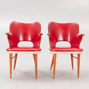 A pair of 1950s armchairs.