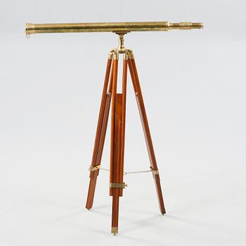 A spotting scope with a wooden stand, second half of the 20th century.