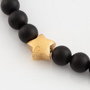 Ole Lynggaard, black stone  bead necklace, clasp star 18K gold with brilliant cut diamond.