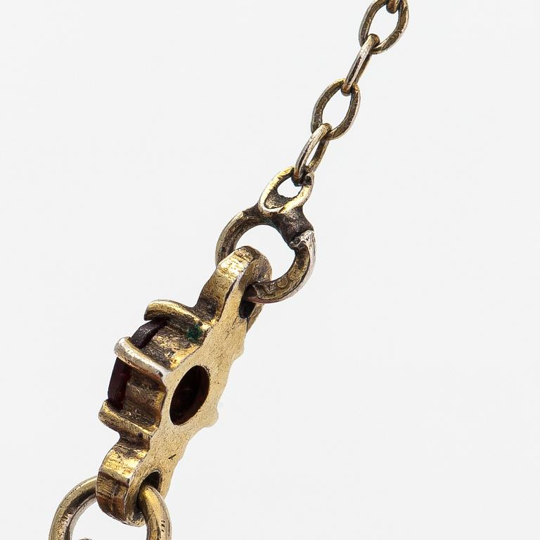 A gilded silver bracelet and necklace with garnets.