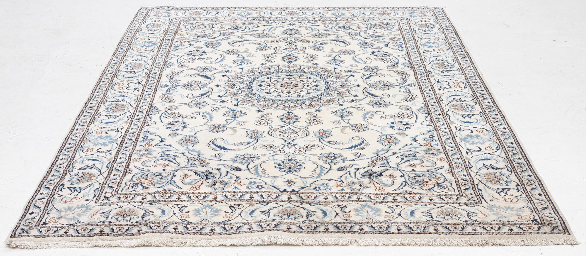 A Nain carpet, c. 275 x 195 cm.