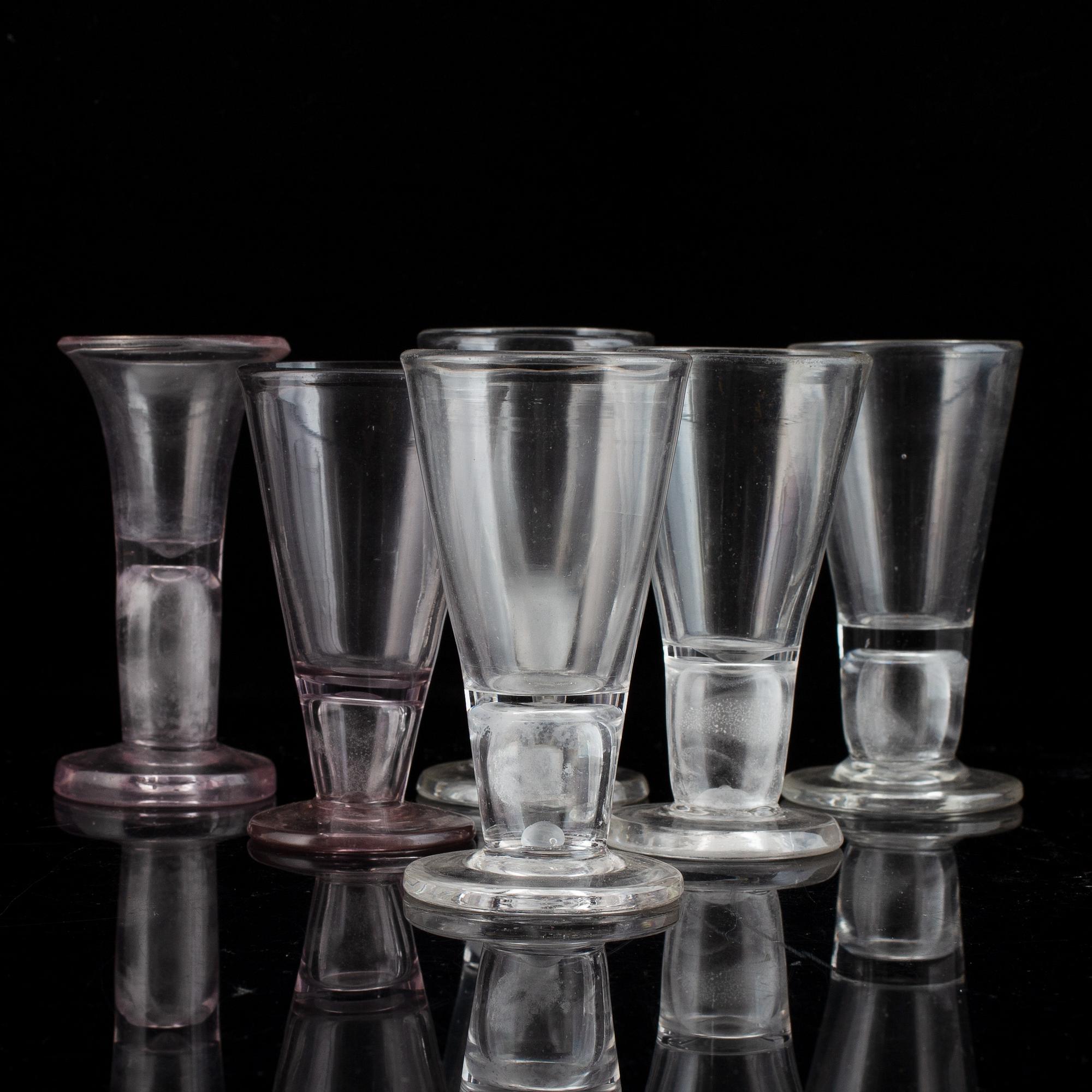Six similar 18th century wine glasses.