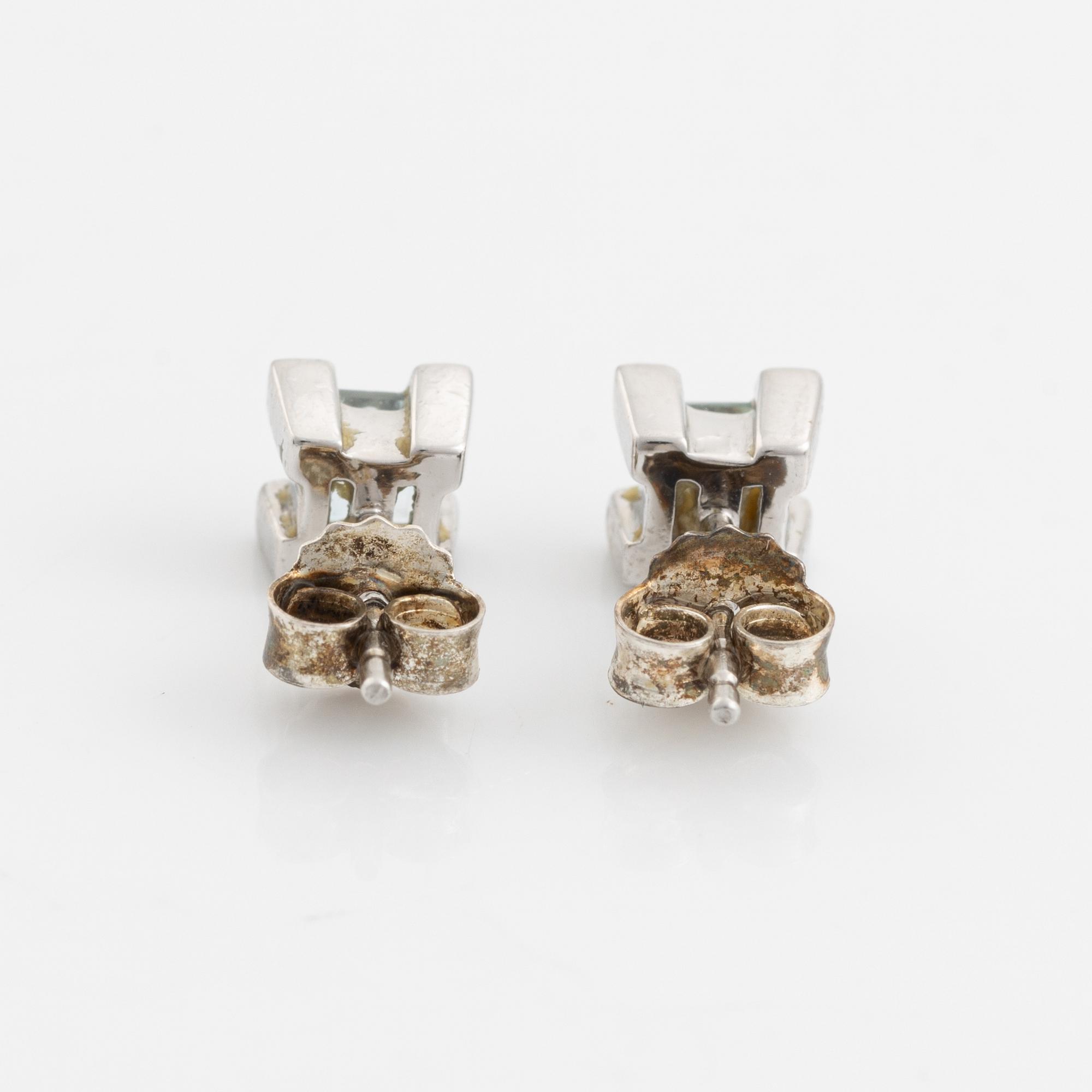 Ring, pendant, and a pair of earrings, 18K white gold with topaz and small diamonds.