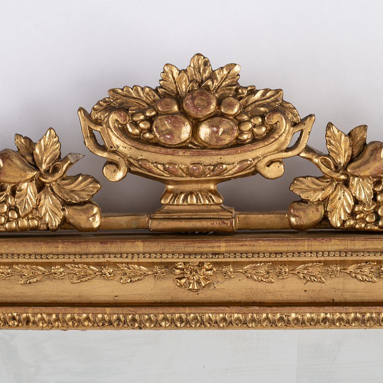 A pair of Swedish Empire mirror wall sconces, first half of the 19th century.