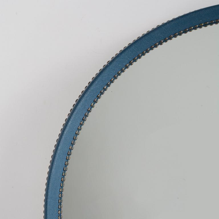 An Otto Schulz blue artificial leather wall mirror, Boet, Gothenburg 1940's-50's.
