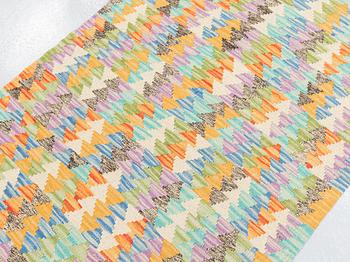 A runner, kilim, ca 391 x 80 cm.