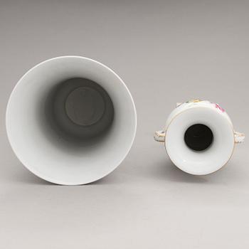 Two Meissen porcelain vases, a platter, an urn and a lidded box from the latter half of 20th century.