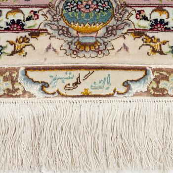A Tabriz rug, signed, c. 160 x 101 cm.