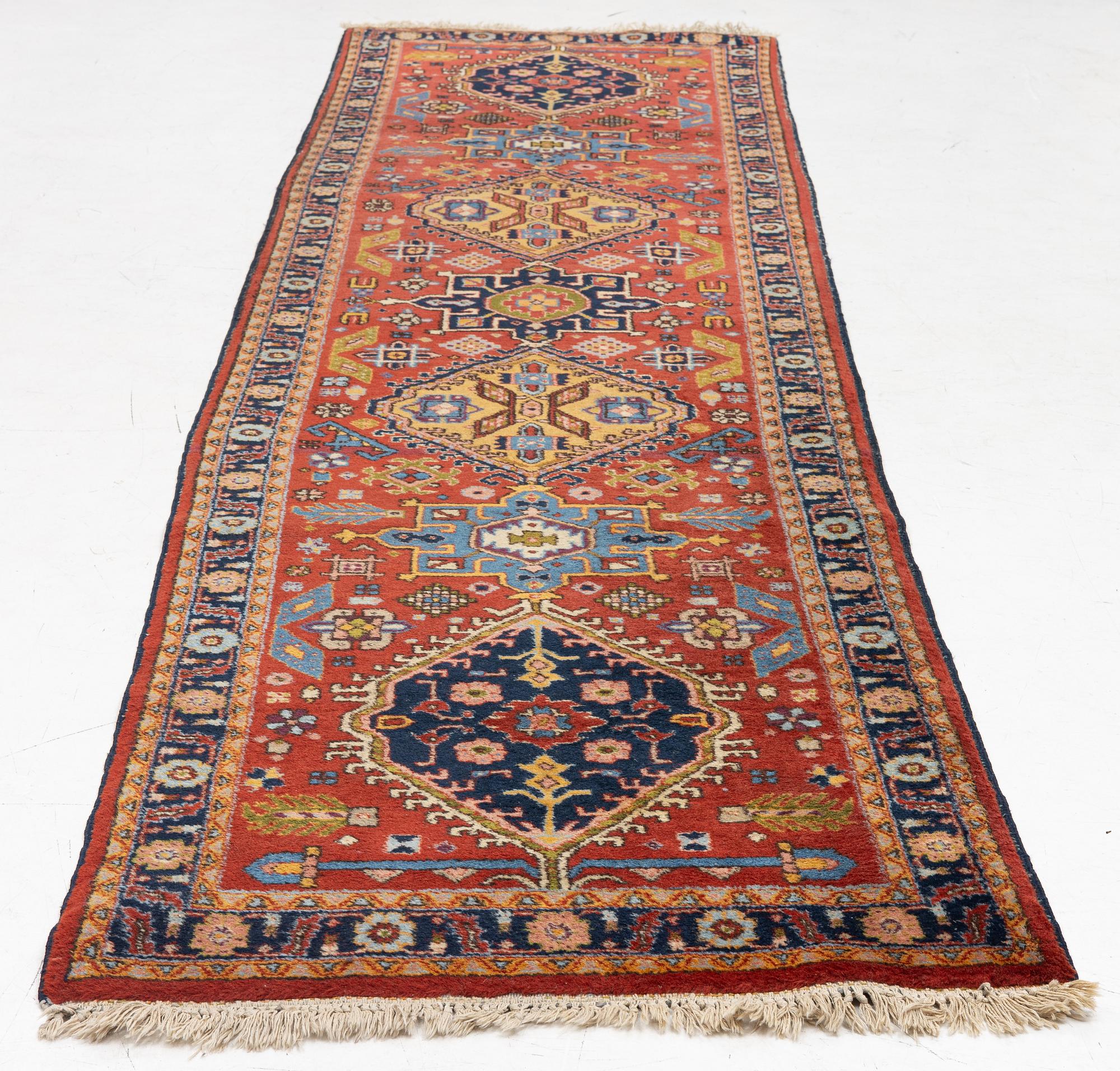 A semi-antique Kurdish runner, 350 x 140 cm.